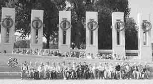 Local veterans stand at the World War II Memorial in Washington. (submitted photo)